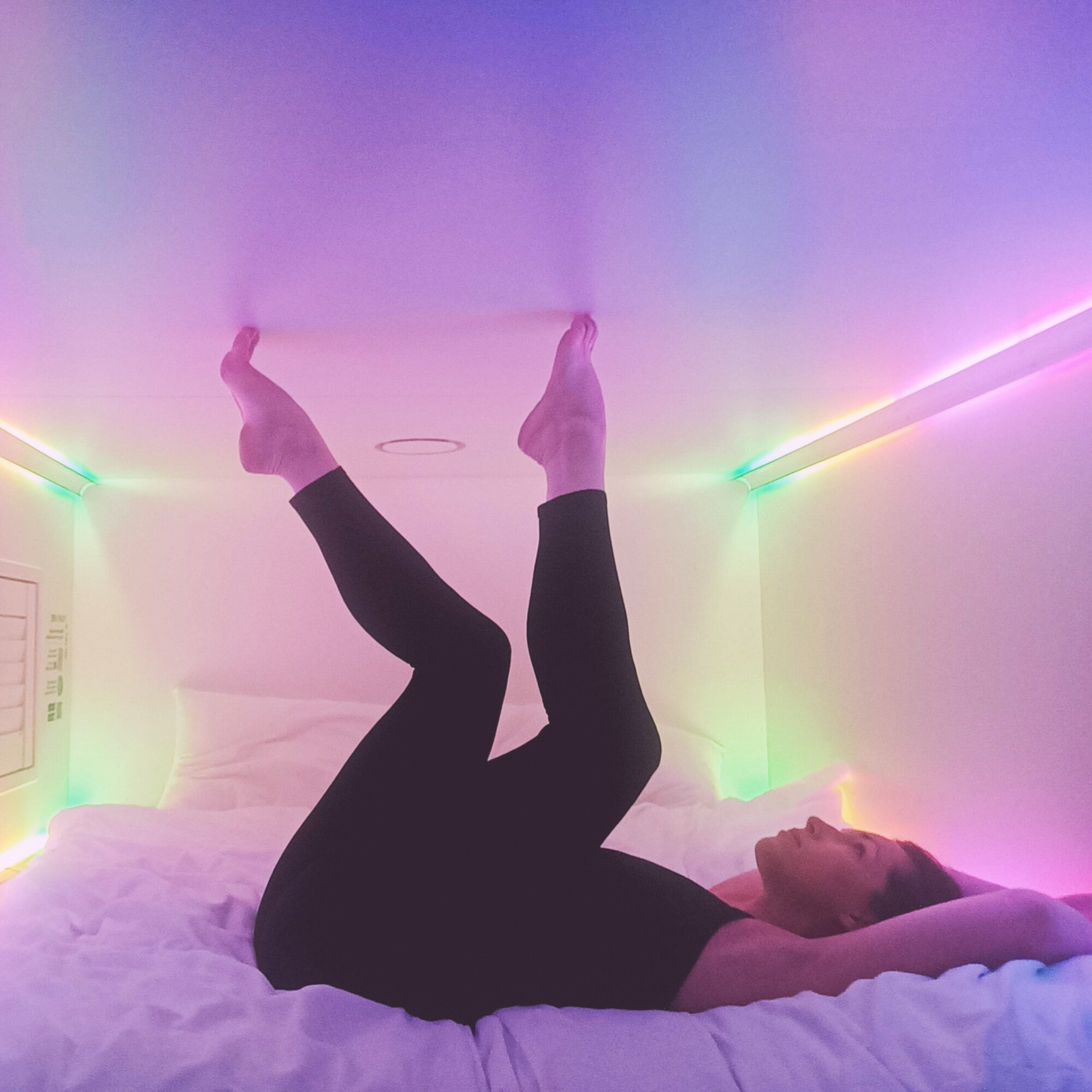 Woman in colorful bedroom