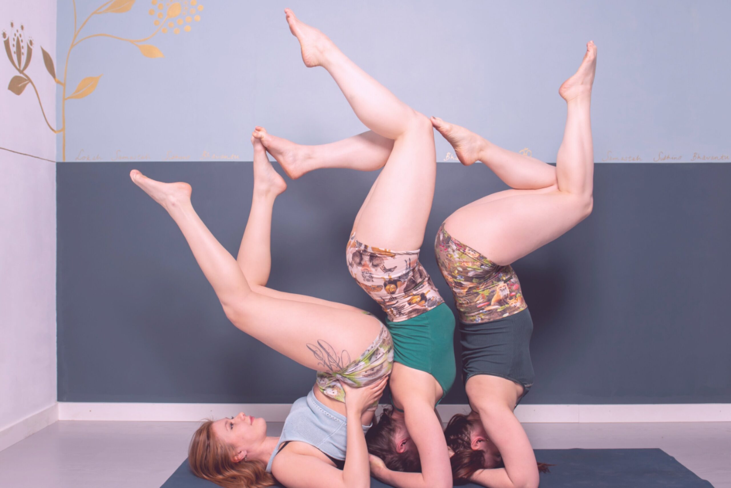 Three women balancing on the floor